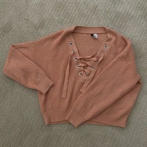 Dusty pink cropped lace up sweater